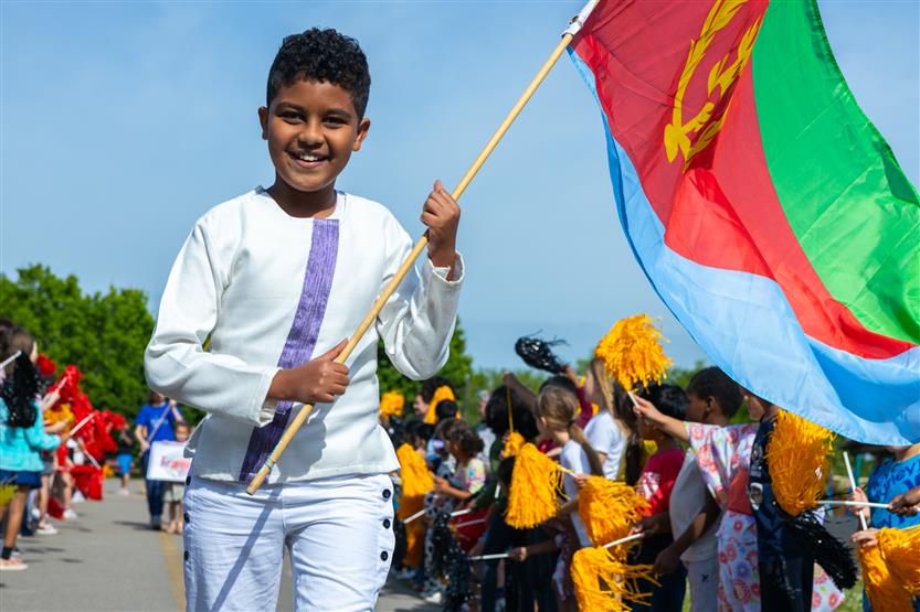 Students participate in flag parade